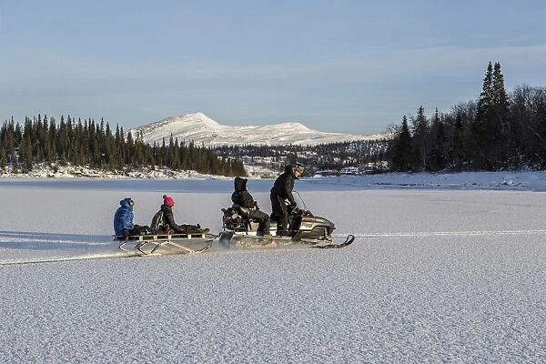 Snowmobile excursion on Lake Limingen Rorvik BA'A¸rgefjell National Park TrA'A¸ndelag Norway Europe