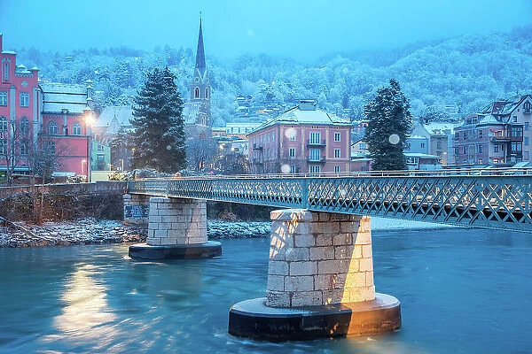 A snowy morning by the bridge of Emile Bethouart with the church of Sankt Nikolaus in the background, Innsbruck, Tyrol, Austria