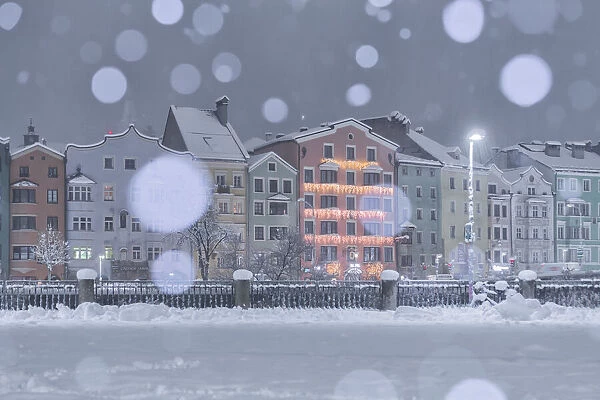 A snowy night by the Mariahilf buildings, Marktplatz, Innsbruck, Tyrol, Austria