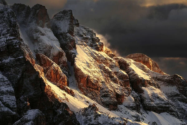 Snowy peaks of the Dolomites during a fiery sunrise from the Giau Pass, Dolomites, Italy