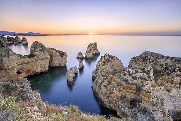 Soft colors of dawn on the cliffs of Ponta da Piedade Lagos Algarve Portugal Europe