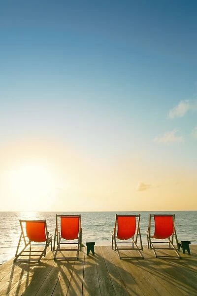 South America, Brazil, Alagoas, Praia do Patacho, sun loungers on a deck overlooking the beach