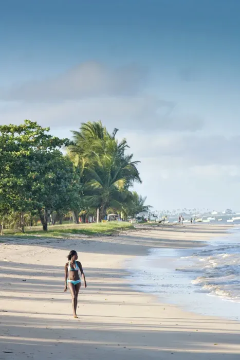 Framed Print : South America, Brazil, Bahia, a black Brazilian model in a bikini woman walks along Framed Print : South America, Brazil, Bahia, a black Brazilian model in a bikini woman walks along