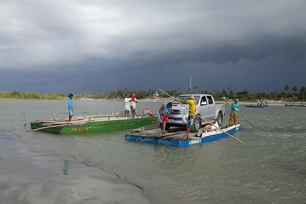 South America, Brazil, Ceara, Camocim, storm clouds over the ferry rafts at Guriu