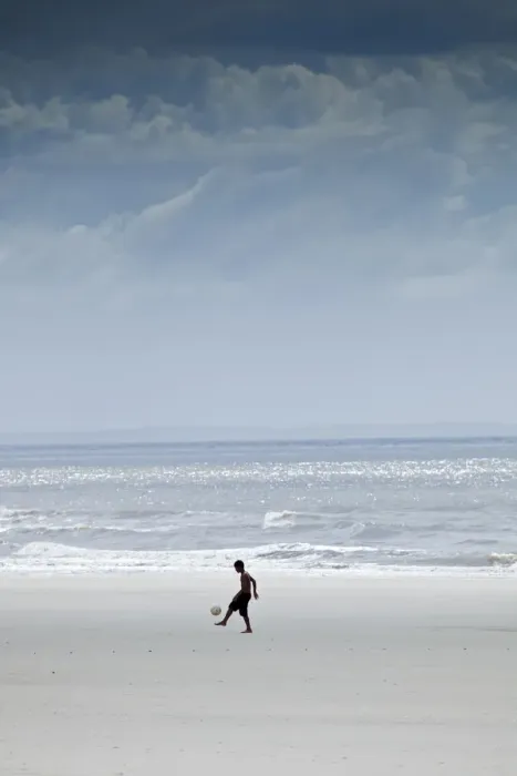 Framed Print : South America, Brazil, Maranhao, Sao Luis, Sao Marcos beach, boy playing football Framed Print : South America, Brazil, Maranhao, Sao Luis, Sao Marcos beach, boy playing football