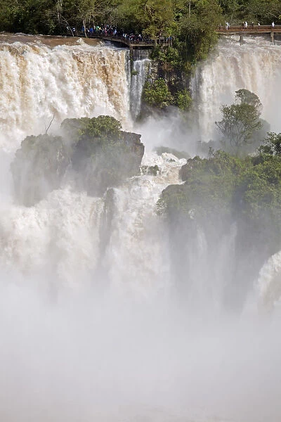 South America, Brazil, Parana, a viewing platform at the Iguazu falls in full flood