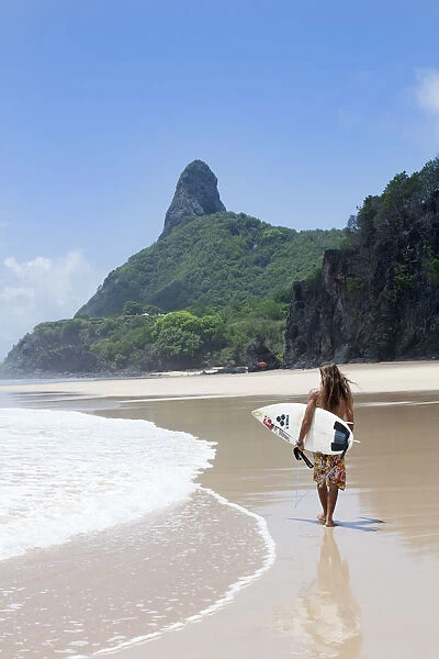 South America, Brazil, Pernambuco, Fernando de Noronha Island, surfer on Father s