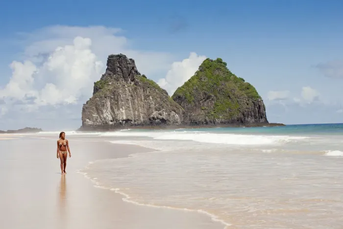 Framed Print : South America, Brazil, Pernambuco, Fernando de Noronha Island, a girl walking along Framed Print : South America, Brazil, Pernambuco, Fernando de Noronha Island, a girl walking along