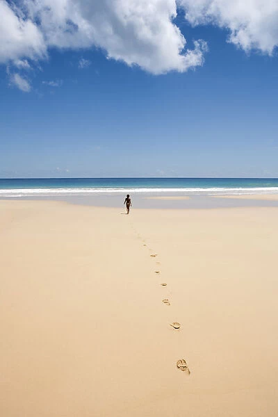 South America, Brazil, Pernambuco, Fernando de Noronha Island, a girl walking along