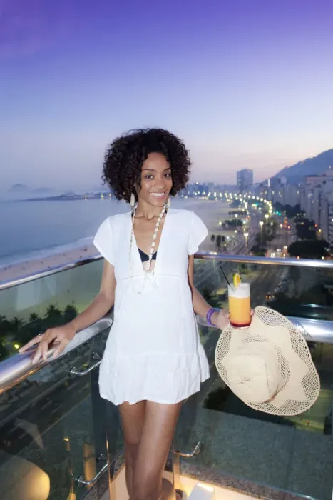 Framed Print : South America, Brazil, Rio de Janeiro, a model with a cocktail stands over Copacabana Framed Print : South America, Brazil, Rio de Janeiro, a model with a cocktail stands over Copacabana