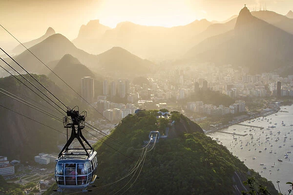 South America, Brazil, Rio de Janeiro. A cable car ascending the Sugar Loaf from Morro da