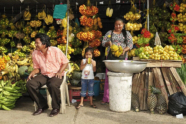 South America, Colombia, Leticia, Amazon region, Family selling fruit at a market