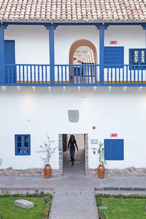 Framed Print : South America, Peru, Cusco, a model walks through an interior courtyard in Framed Print : South America, Peru, Cusco, a model walks through an interior courtyard in