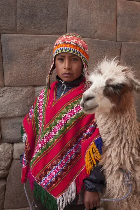 Framed Print : South America, Peru, Cusco. A Quechua boy in a poncho and a chullo woollen cap with