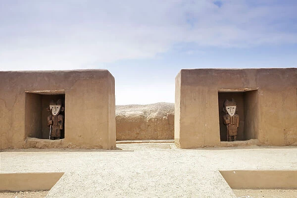 South America, Peru, La Libertad, Trujillo, wooden statues set in alcoves in an adobe