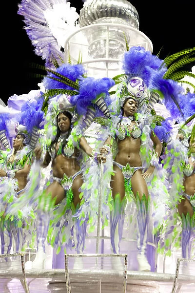 South America, Rio de Janeiro, Rio de Janeiro city, costumed dancers wearing feathers