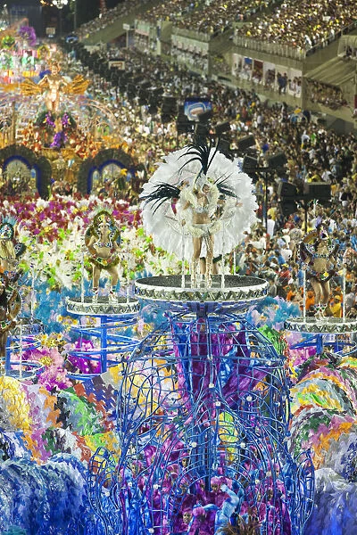 South America, Rio de Janeiro, Rio de Janeiro city, costumed dancer in a feather headdress