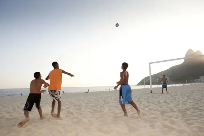 Framed Print : South America, Rio de Janeiro, Rio de Janeiro city, Ipanema, boys playing football Framed Print : South America, Rio de Janeiro, Rio de Janeiro city, Ipanema, boys playing football