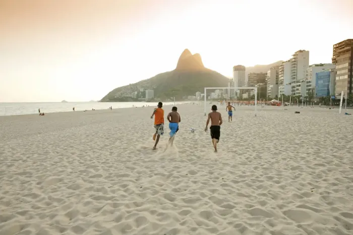 Framed Print : South America, Rio de Janeiro, Rio de Janeiro city, Ipanema, boys playing football Framed Print : South America, Rio de Janeiro, Rio de Janeiro city, Ipanema, boys playing football