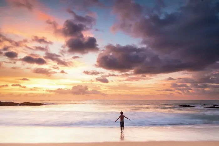 Framed Print : South East Asia, Thailand, Phang Nga Province, Khao Lak. A young boy plays on the beach at sunset. (MR)