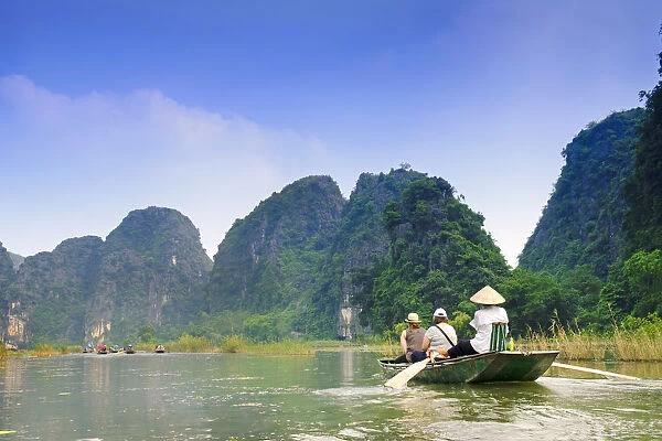 South East Asia, Vietnam, Ninh Binh, Tam Coc, river, rowing boat and limestone karsts