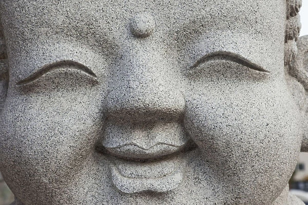 South Korea, Seoul, Jogyesa Temple, Facial Detail of Stone Buddha Carving