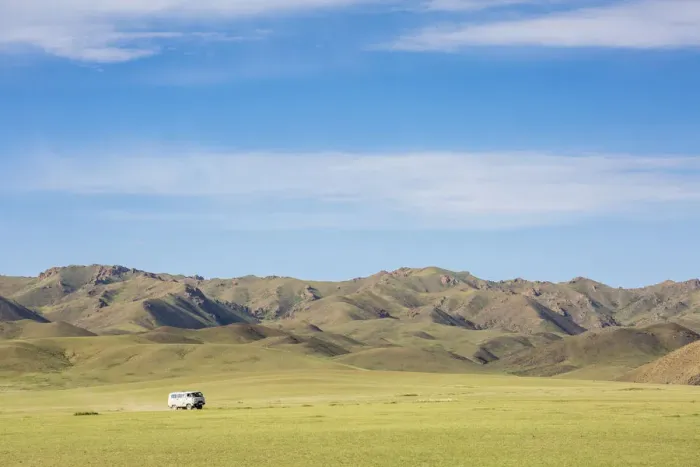 Framed Print : Soviet minivan and mountains in the background. Bayandalai district, South Gobi province Framed Print : Soviet minivan and mountains in the background. Bayandalai district, South Gobi province