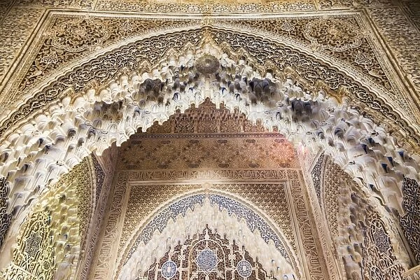 Spain, Andalusia, Granada. The Alhambra. Ornate arches inside the Alhambra
