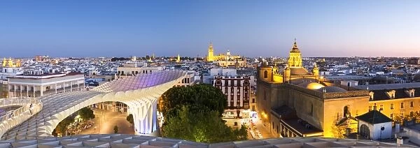 Spain, Andalusia, Seville. Metropol Parasol structure and city at dusk