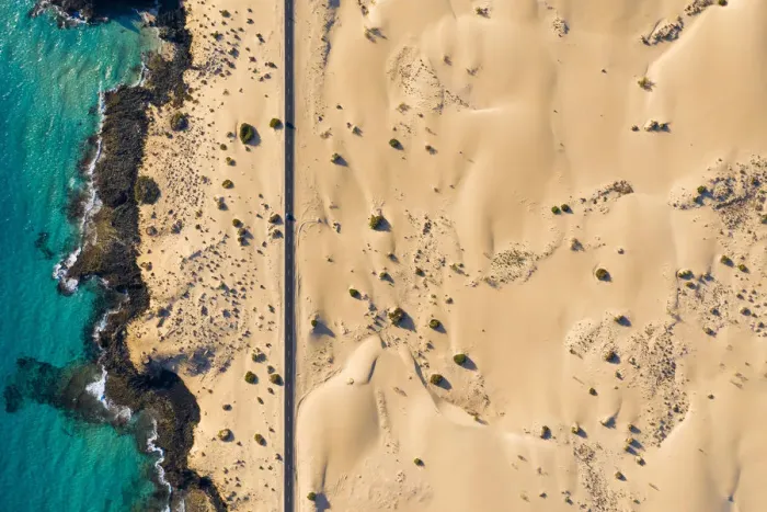 Framed Print : Spain, Canary Islands, Fuerteventura, aerial view of road crossing Corralejo Dunes Framed Print : Spain, Canary Islands, Fuerteventura, aerial view of road crossing Corralejo Dunes