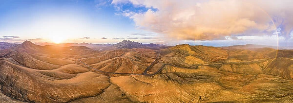 Spain, Canary Islands, Fuerteventura, mountain road crossing the volcanic landscape near