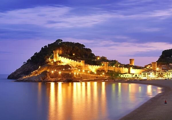 Spain, Catalonia, Costa Brava, Tossa de Mar, Overview of bay and castle at dusk (MR)