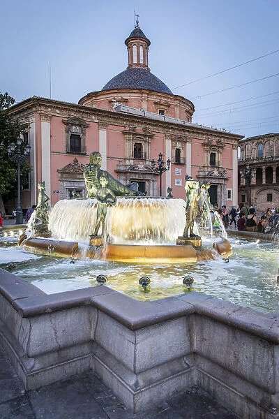 Spain, Comunidad Valenciana, Valencia, The Neptune's fountain with the Real Basilica De Nuestra Senora De Los Desamparados on the back