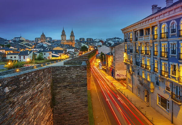 Spain, Galicia, Lugo Roman walls and cathedral illuminated at night