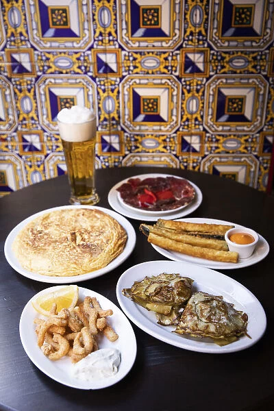 Spain, Madrid, Bodega La Ardosa, Tapas on a table of Bodega La Ardosa restaurant