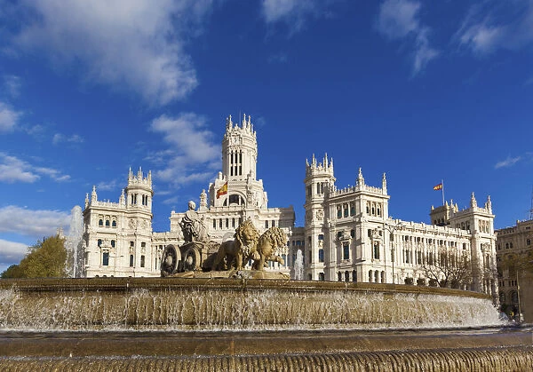 Spain, Madrid. Plaza de Cibeles with fountain and town hall building behind