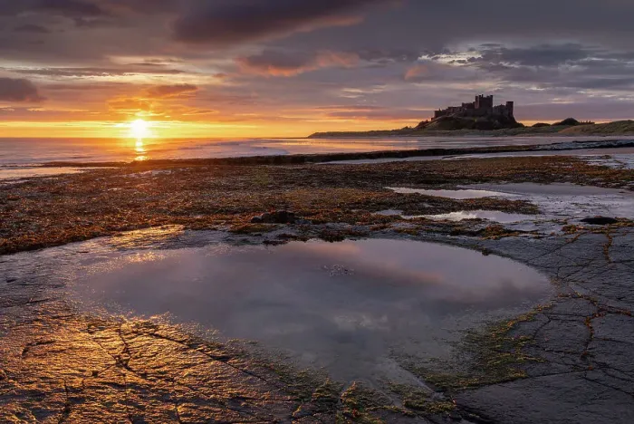 Framed Print : Spectacular sunrise over the North Sea near Bamburgh Castle, Northumberland, England. Autumn (October) 2021 Framed Print : Spectacular sunrise over the North Sea near Bamburgh Castle, Northumberland, England. Autumn (October) 2021