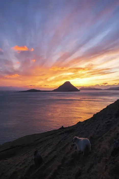 Framed Print : A spectacular sunset in Velbastaður. Island of Streymoy. The island of Koltur in the background. Faroe Islands