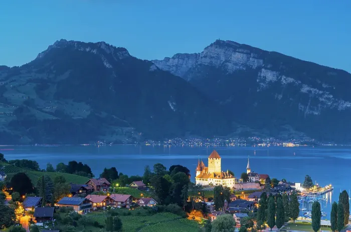 Framed Print : Spiez Castle with Niederhorn mountain in the background at dusk, Spiez, Canton of Bern, Switzerland Framed Print : Spiez Castle with Niederhorn mountain in the background at dusk, Spiez, Canton of Bern, Switzerland