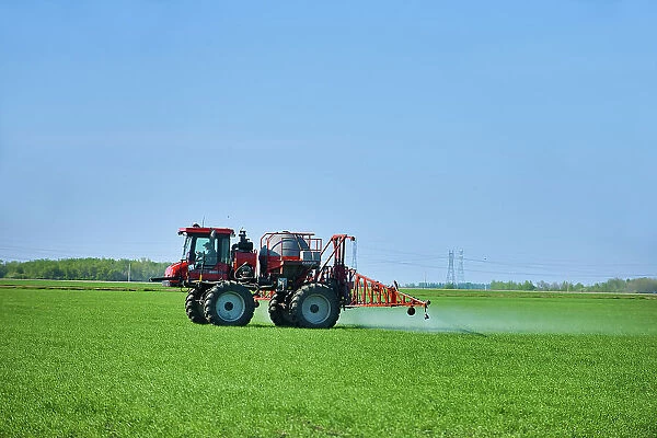 Spraying an early crop growth Dugald, Manitoba, Canada
