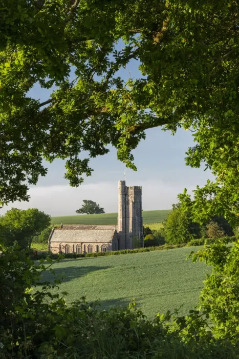 Framed Print : Spring foliage surrounding Shobrooke Church near Crediton, Devon, England