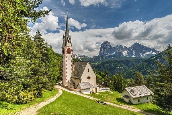 St. Jakob church with Langkofel - Sassolungo mountain group in the background, Ortisei
