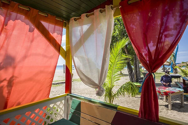 St. Kitts and Nevis, Nevis, Pinneys Beach, beach lounge with curtains