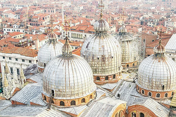 St Mark's Basilica domes, and city rooftops, Venice, Veneto, Italy