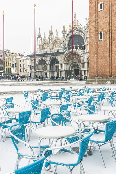 St Marks square, Venice, Veneto, Italy. Bar tables with snow