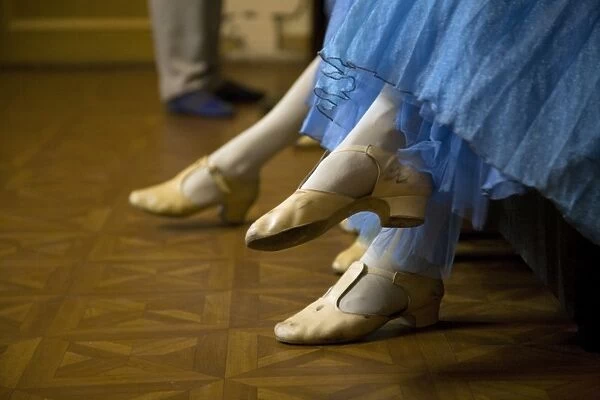 St. Petersburg, Russia; Detail of ballerinas shoes and dress during a short rest backstage during the perfromance of Tchaikovskys ballet