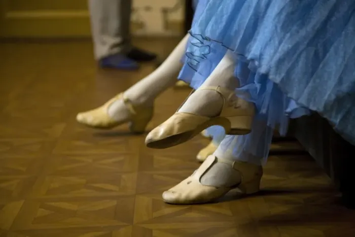 Framed Print : St. Petersburg, Russia; Detail of ballerinas shoes and dress during a short rest backstage during the perfromance of Tchaikovskys ballet Framed Print : St. Petersburg, Russia; Detail of ballerinas shoes and dress during a short rest backstage during the perfromance of Tchaikovskys ballet
