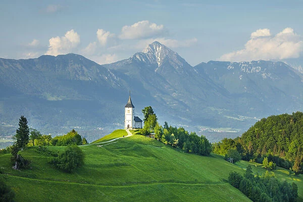St. Primoz Church with Kamnik-Savinja Alps, Jamnik, Gorenjska, Slovenia, Europe