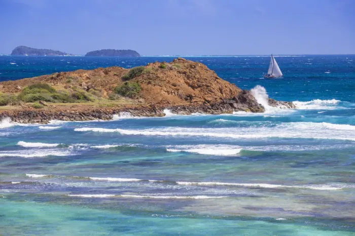 Framed Print : St Vincent and The Grenadines, Yatcht passing by Union Island, with Tobago Cays in Framed Print : St Vincent and The Grenadines, Yatcht passing by Union Island, with Tobago Cays in