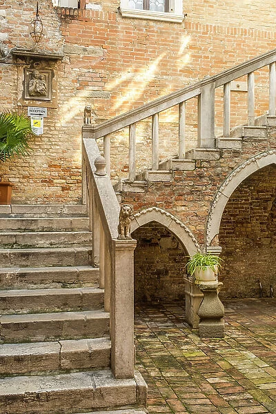 Staircase in a courtyard in Dorsoduro, Venice, Veneto, Italy
